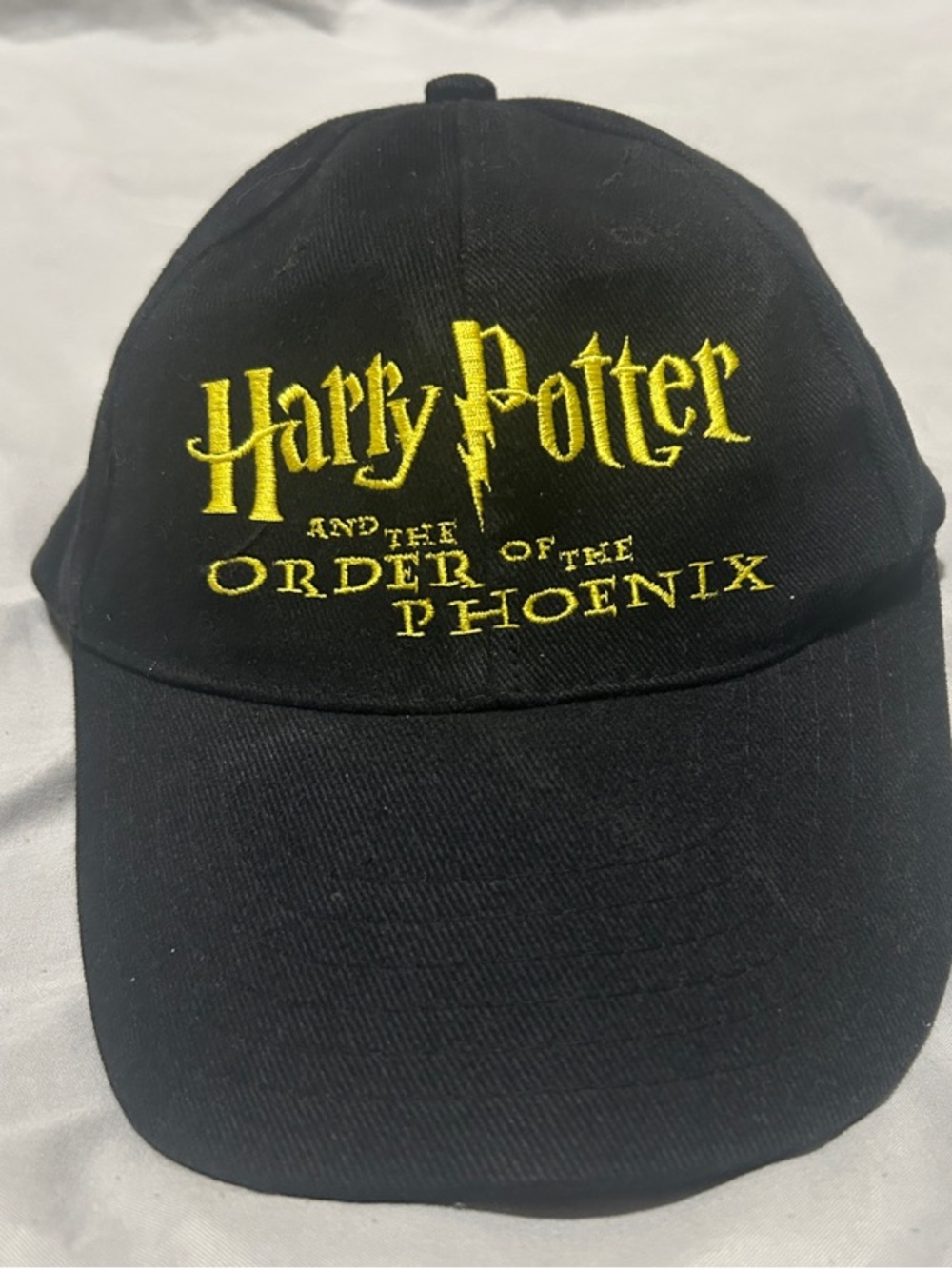 Scholastic Black Cap with Yellow Date Embroidery
